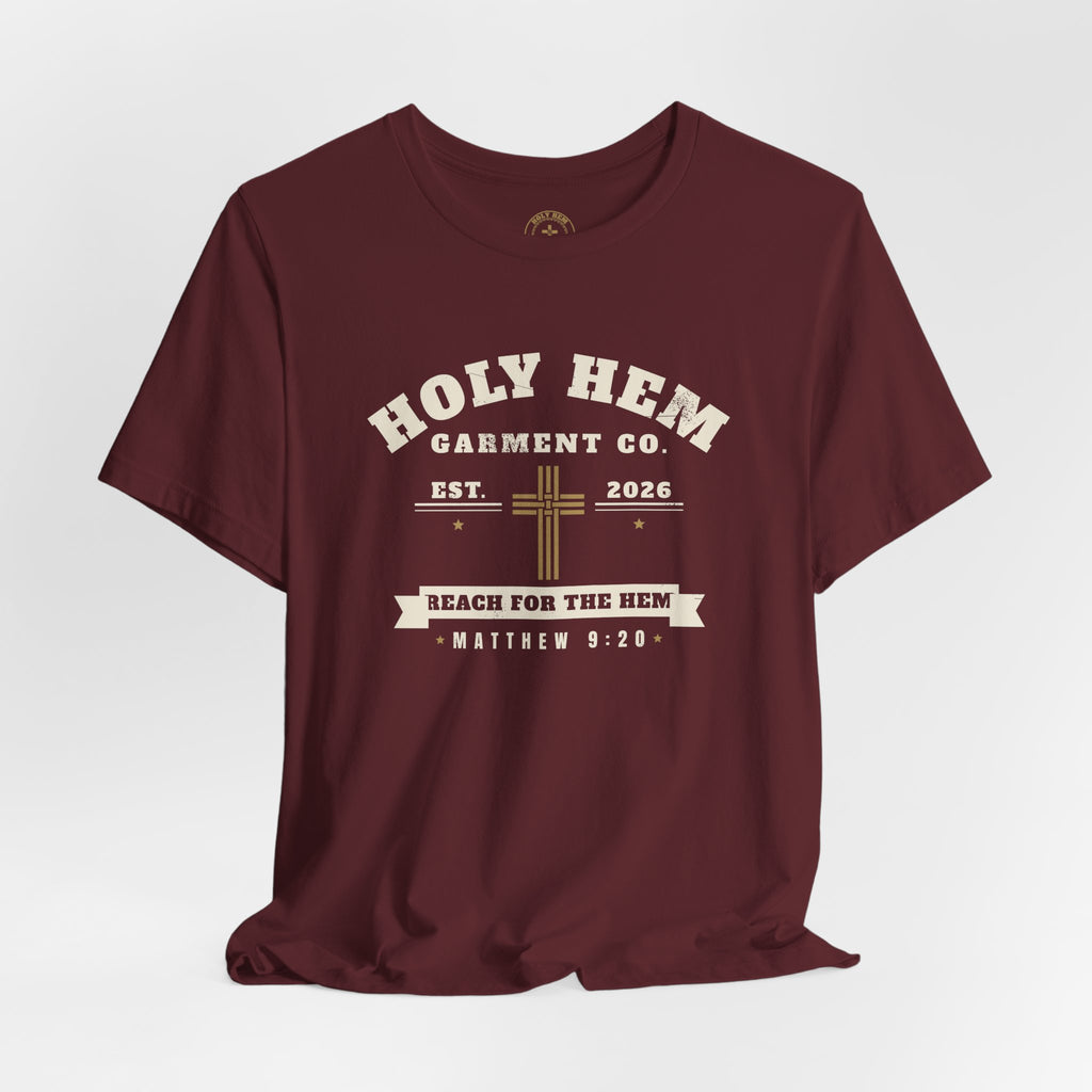 Holy Hem Garment Co. T-Shirt – Vintage Cross Badge Matthew 9:20 Tee